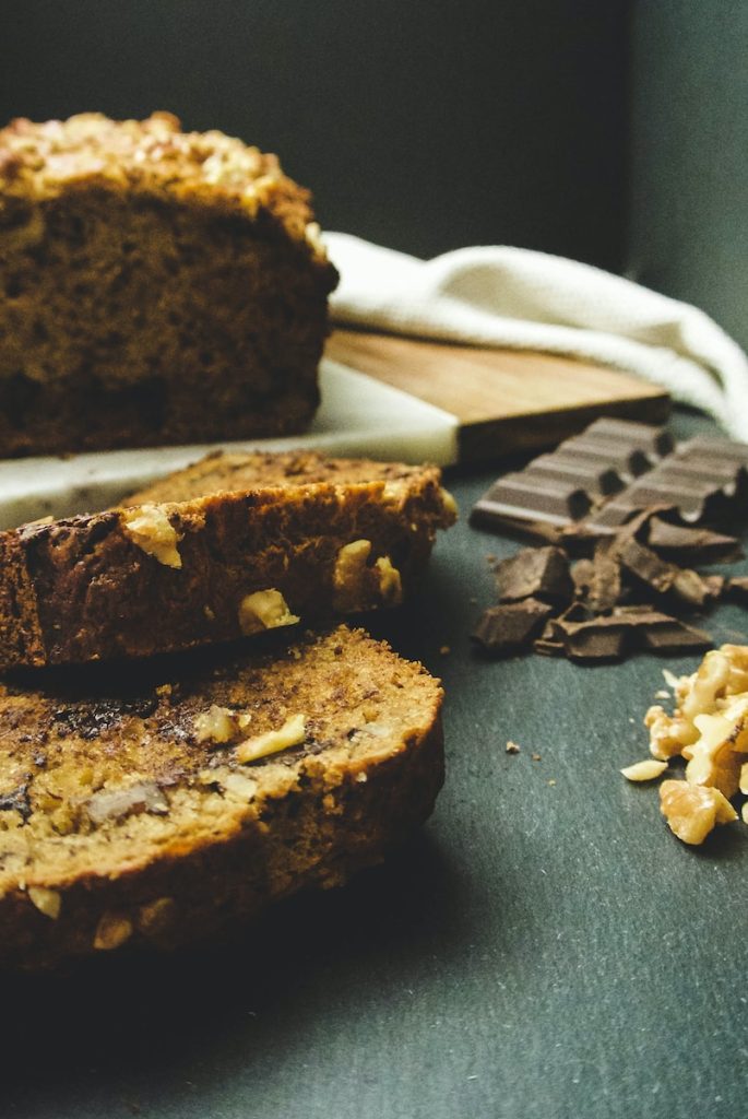 sliced cake near chocolates